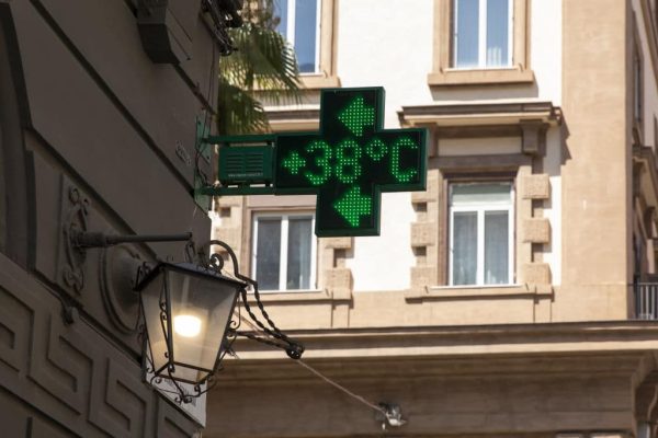 NAPLES, ITALY - JULY 30: A pharmacy's signboard displays the temperature (38°C), in Naples, Italy on July 30, 2024. A new heat emergency hit Naples, with alert level 3. Temperatures have reached 40 degrees. This is what the bulletin of the National Alarm Forecasting System for the prevention of the effects of heat waves on health had already anticipated yesterday, with the technical-scientific support of the Competence Center of the Civil Protection Department. (Photo by Stringer/Anadolu via Getty Images)